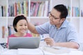 Smart schoolgirl praised by her teacher Royalty Free Stock Photo