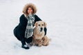 Picture of smiling girl with dog in winter park Royalty Free Stock Photo