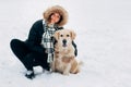 Picture of smiling girl with labrador in winter park Royalty Free Stock Photo