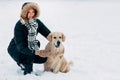 Picture of smiling woman with dog in winter park Royalty Free Stock Photo