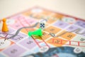 Picture of snakes and Ladders Game with tokens and dice