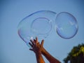 Picture with soap bubbles against a blue sky Royalty Free Stock Photo