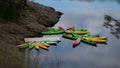 Multicolor moored kayaks in a tiny pier Royalty Free Stock Photo