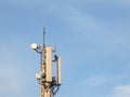 Mobile phone base station, equiped with 3G, 4G and 5G antenna, at the top of a European building, used for cellular phone network Royalty Free Stock Photo