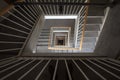 Selective blur on an old staircase, a swirling spiral stairway in a dwelling residential building, seen from above, from the highe