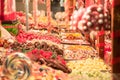 Candies, mainly gummy sweets and lollilpops, diversified, display in loose in a candy shop during a carnival or a fair
