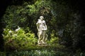 Statue in the middle of a green garden at Magnolia plantation in Charleston South Carolina Royalty Free Stock Photo