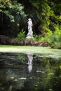 Statue in the middle of a green garden at Magnolia plantation in Charleston South Carolina Royalty Free Stock Photo