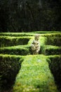 Statue in the middle of a green garden at Magnolia plantation in Charleston South Carolina Royalty Free Stock Photo