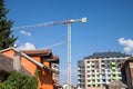 Peri urban scenery of the suburb of Belgrade, with cranes on a construction site with modern housing buildings being built