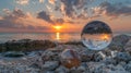 A picture of a sunset over the ocean with two glass balls, AI Royalty Free Stock Photo