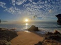 Picture of sunset rock wave sand beach