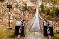 Picture of a suspension bridge over the mountain river Royalty Free Stock Photo