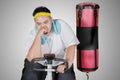 Sweaty fat man doing workout with exercise bike Royalty Free Stock Photo