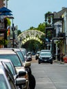 Picture taken on the corner of St. Ann and Bourbon Street of the entrance of Armstrong Park. Also cars parked on the side. Royalty Free Stock Photo