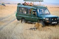 A deep green safari jeep