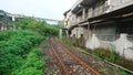 A railway surrounds the houses