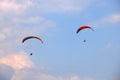 Picture of tandem paragliders in the sky of Interlaken, Switzerland. Royalty Free Stock Photo