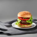 Picture of a tasty hamburger with greens, classic fast food item, Generative AI