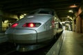 French Fast Train TGV ready for departure on the platform of Paris Montparnasse train station.