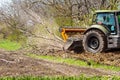 Picture of a tractor specialized in forest clearing that is in the process of destroying all the trees and bushes. Stop Royalty Free Stock Photo