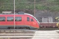 Red train, and EMU electric multiple unit of Slovenian Railways shunting on Ljubljana train station platform getting ready Royalty Free Stock Photo