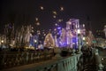 Tromostovje Triple Bridge taken at night during the Christmas period with Christmas decorations.