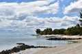 Picture of a tropical beach with boats at the anchorage. Vacations background. Royalty Free Stock Photo