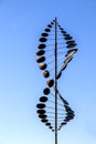 Twisting metal weathervane with circles