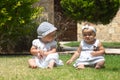 Picture of two baby child having fun playing outdoors, best friends, happy family, love and happiness concept Royalty Free Stock Photo