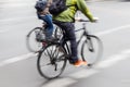 two bicycle riders on a city street iwith motion blur Royalty Free Stock Photo
