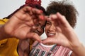 Picture of two black women making a heart with hands