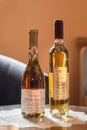 Two bottles of Tokaji wine on a fancy glass table. Tokay is a white sweet wine from the Tokaji region Royalty Free Stock Photo