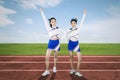 Two cheerleaders cheering at the football field Royalty Free Stock Photo