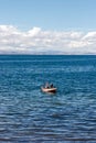 Two fishermen on a boat in Amantani Island, Titicaca Lake, Peru