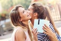 A picture of two girl friends making a surprise birthday present Royalty Free Stock Photo