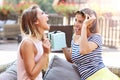 A picture of two girl friends making a surprise birthday present Royalty Free Stock Photo