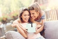 A picture of two girl friends making a surprise birthday present Royalty Free Stock Photo