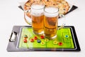 Picture of two mugs of beer, table football, pizza Royalty Free Stock Photo