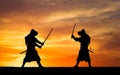 Picture with two samurais and sunset sky Royalty Free Stock Photo
