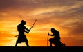 Picture with two samurais and sunset sky Royalty Free Stock Photo