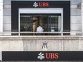 An entering a local branch of UBS Union Bank Switerland in Geneva. UBS is one of the main banks of the country Royalty Free Stock Photo