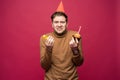 Picture of unhappy stressed young man having unhappy look, feeling tired and worn out with birthday party preparations