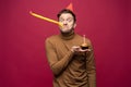 Picture of unhappy stressed young man having unhappy look, feeling tired and worn out with birthday party preparations