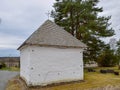 Picture with very old stone house, interesting wooden tile roof