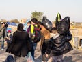 Volunteer carrying a baby, surrounded by refugees walking towards the Croatia Serbia border, between cities of Bapska & Berkasovo