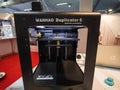 Wanhao logo on a 3D printer on display. Wanhao is a Chinese manufacturer of 3D printers and tools, for industrial and house uses