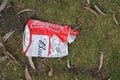 Budweiser beer can crushed on grass at an outdoor event