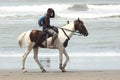 The picture was taken of a man The picture holds a man riding a horse by the sea in Bangladesh Cox& x27;s Bazar.