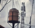 A picture of watertank and radio transmitter in dense population in jakarta Indonesia